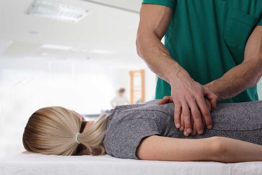 A person lying comfortably on their side in bed with relaxed posture and a calm facial expression.