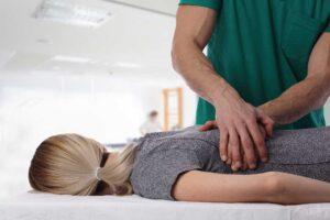 A person lying comfortably on their side in bed with relaxed posture and a calm facial expression.